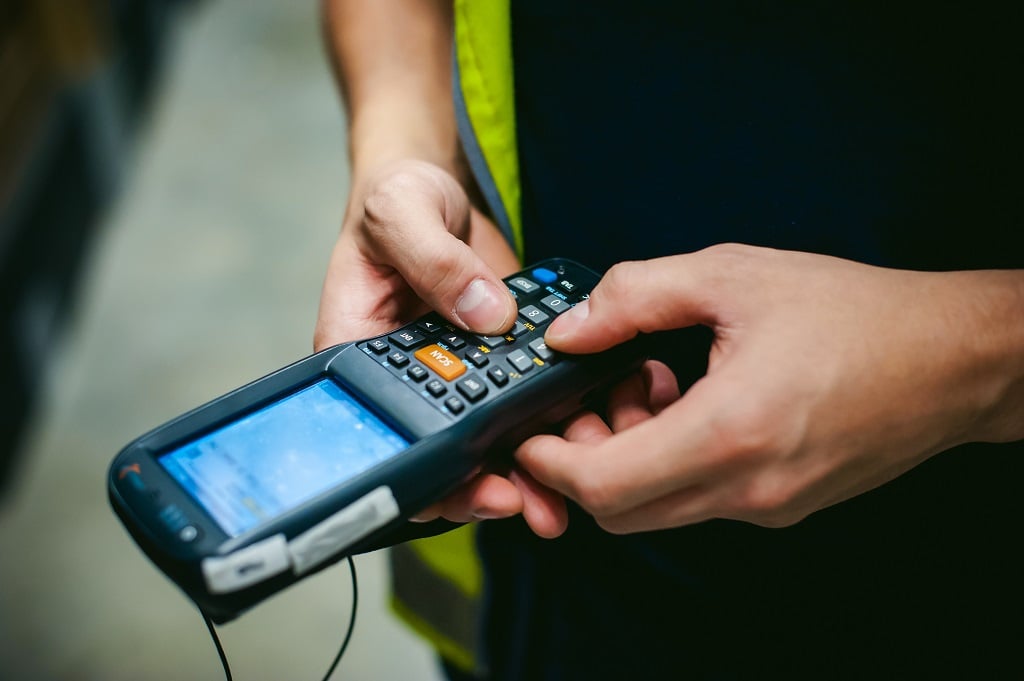 Worker with Bar Code Scanner